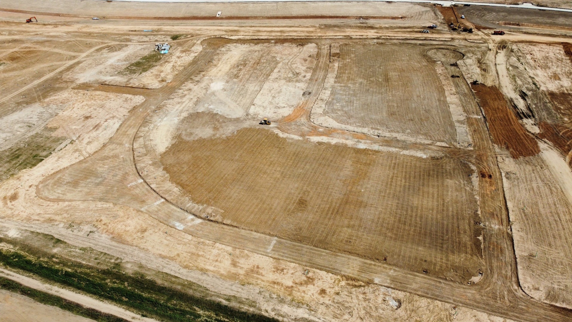 Mass grading with excavator on Fort Bend County construction site by Lone Star JC Construction